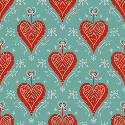 Red hearts Christmas ornaments on mint green